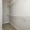 a closet with a metal railing