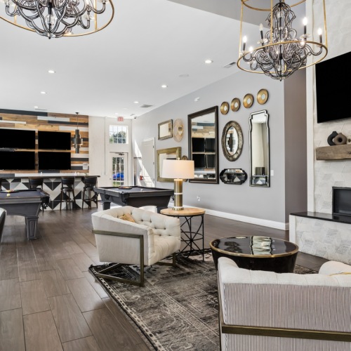 Clubhouse with furniture and a fire pit