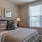 a bed with a lamp on the side