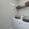 a washer and dryer with a basket on top of it